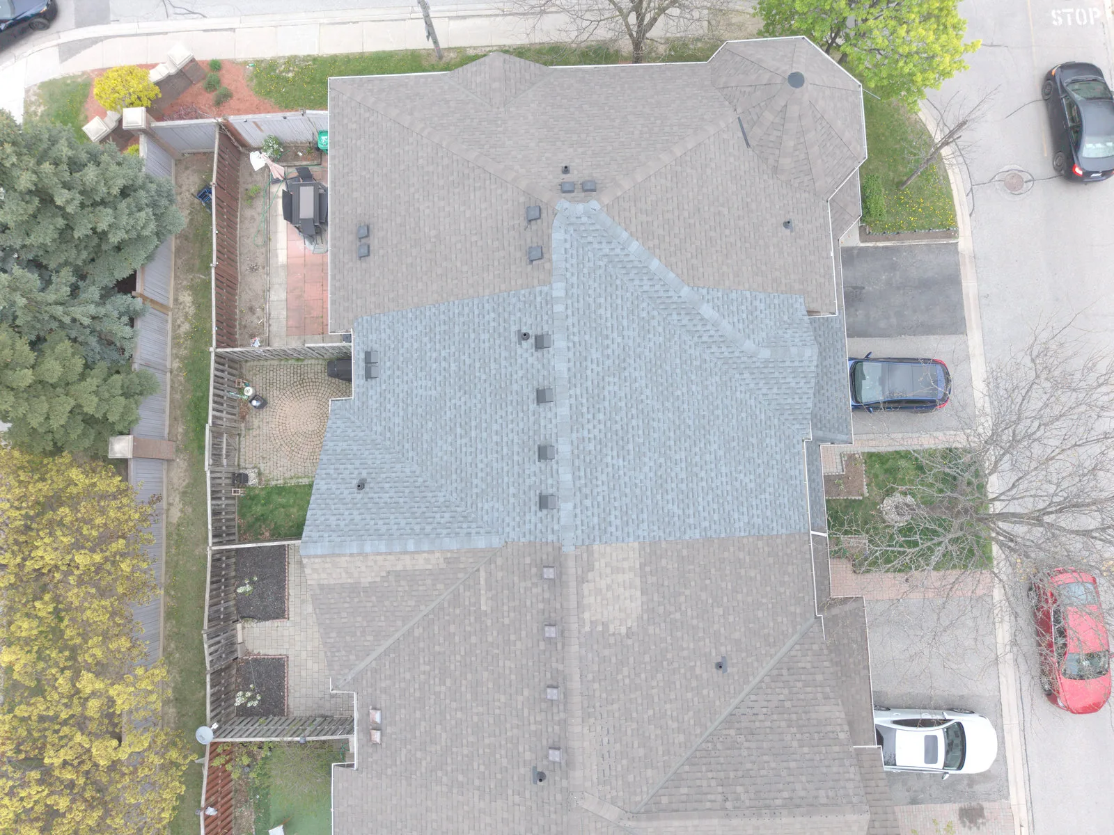 Finished asphalt shingle roof on a Brampton home, aerial view