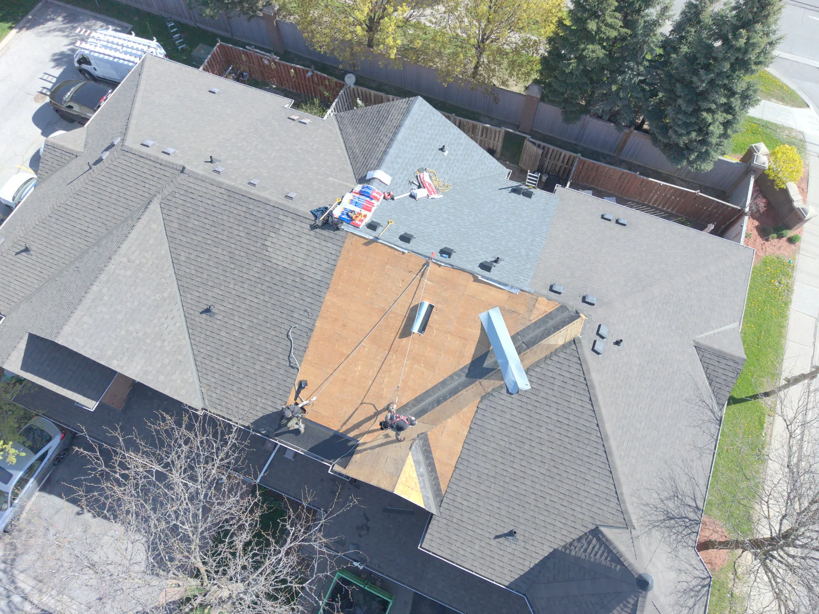 Roof replacement in progress on a Brampton home, aerial view