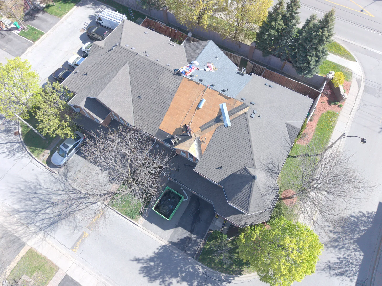 Aerial view of a Brampton roof during shingle replacement