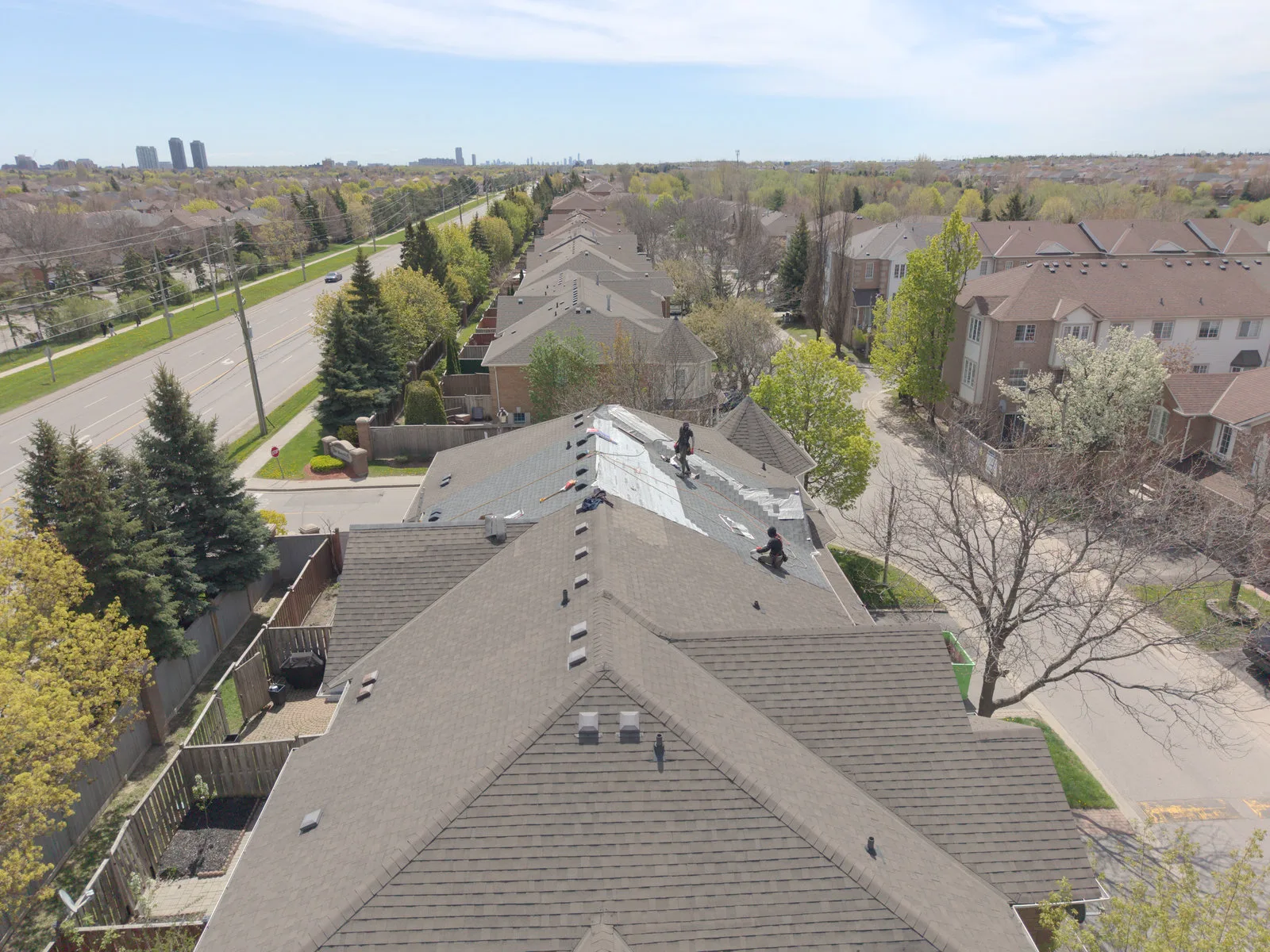 New shingles being installed on a Brampton roof, aerial view
