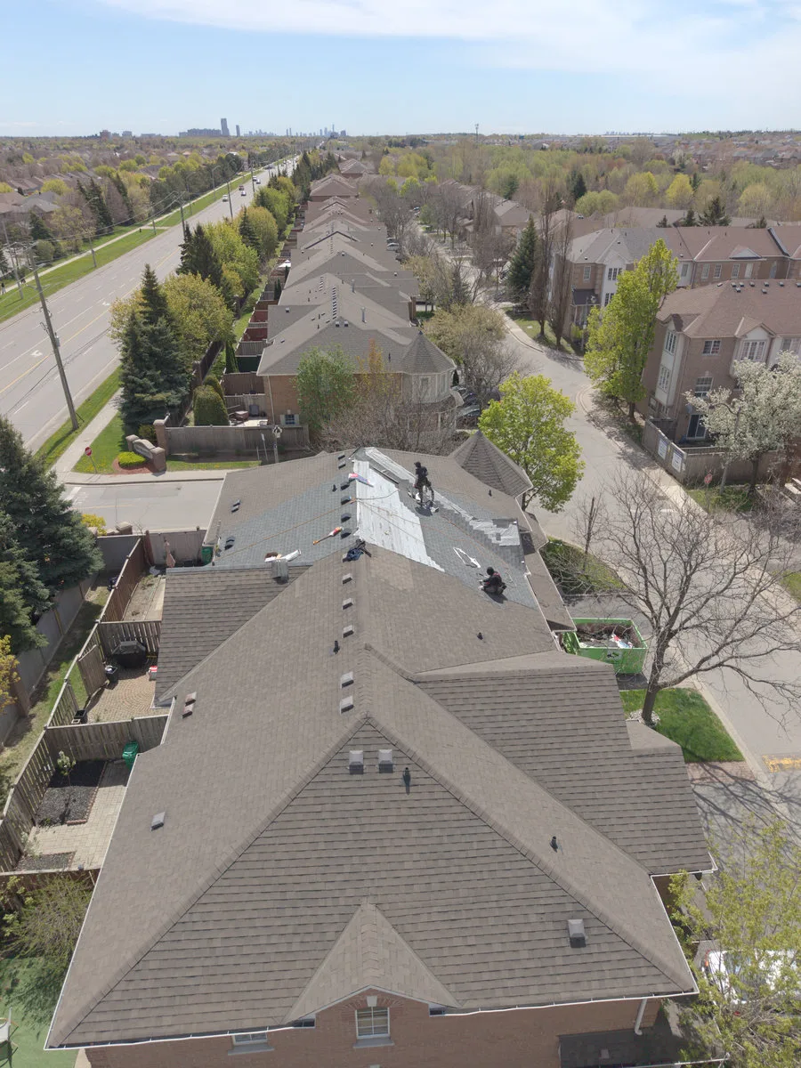 Partially completed roof replacement on a Brampton home, aerial view